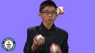 He JUGGLED and SOLVED 3 Rubiks cubes  Guinness World Records [upl. by Aikkan737]